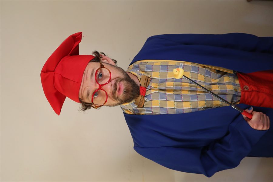 The Clown Professor pointing at his board